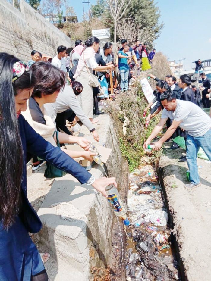 Residence disposing seized ‘illegal IMFL and local brews’ in Khikha-Rüleizou colony, Kohima under the initiative of Khikha-Rüleizou Youth Organisation (KRYO) and Women Organization (KRWO). (File Photo)
